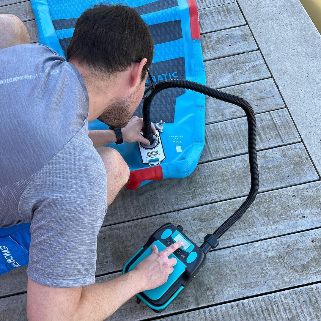 Portable air tent pump and electric pump for kayaks, canoes, and paddle boards, designed for fast inflation on outdoor water adventures.
